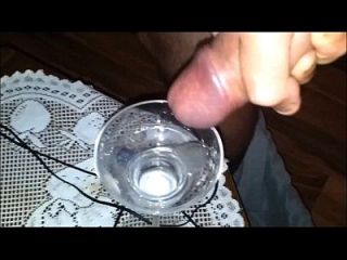 girl collects thick cum in a glass